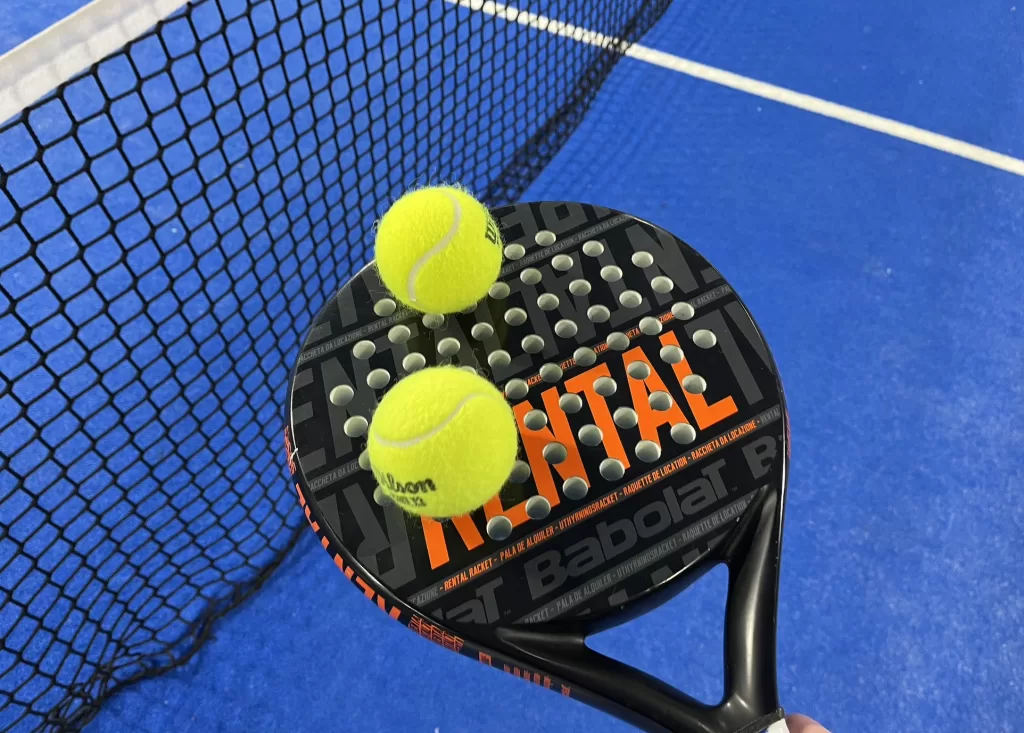 Padel balls on padel racket